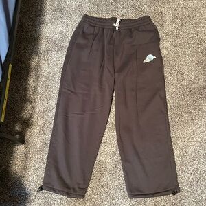 Grey drawstring sweatpants with planet and cloud design